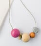 Isla - Hot pink, olive green, burnt orange necklace with grey hexagonal bead - Image 4