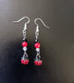 Beaded red, black and silver ladybird charm dangle earrings - Image 1