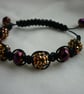 GOLD, RAINBOW IRIS AND BLACK MACRAME BRACELET. - Image 1