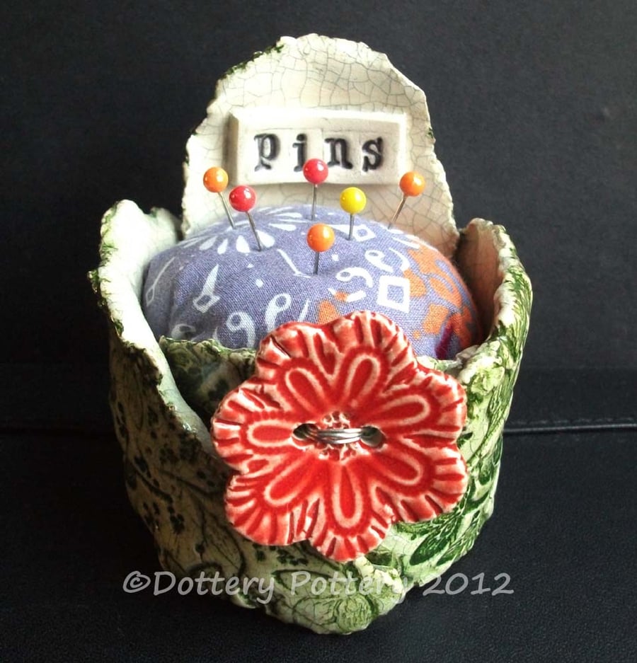 ceramic pincushion with flower button