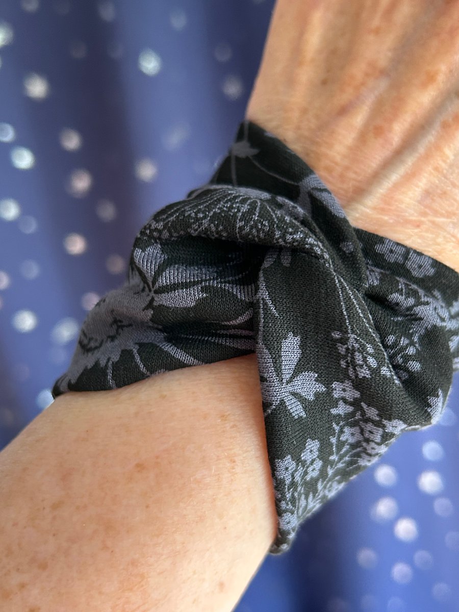 Black wide cuff bracelet with wildflower design 