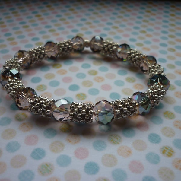 GREEN AB, ROSE AB AND SILVER BRACELET.