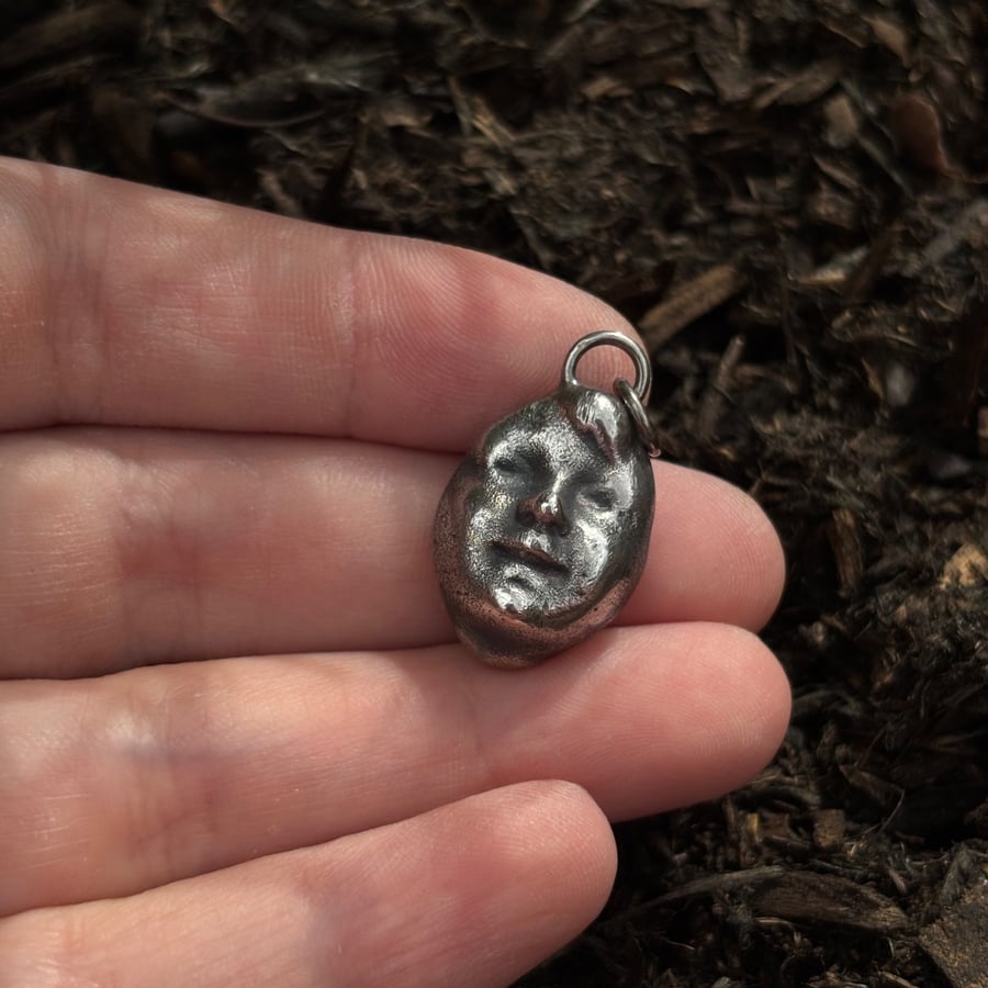 Victorian doll's head pendant