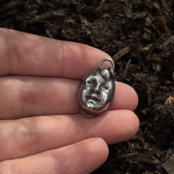 Victorian doll's head pendant