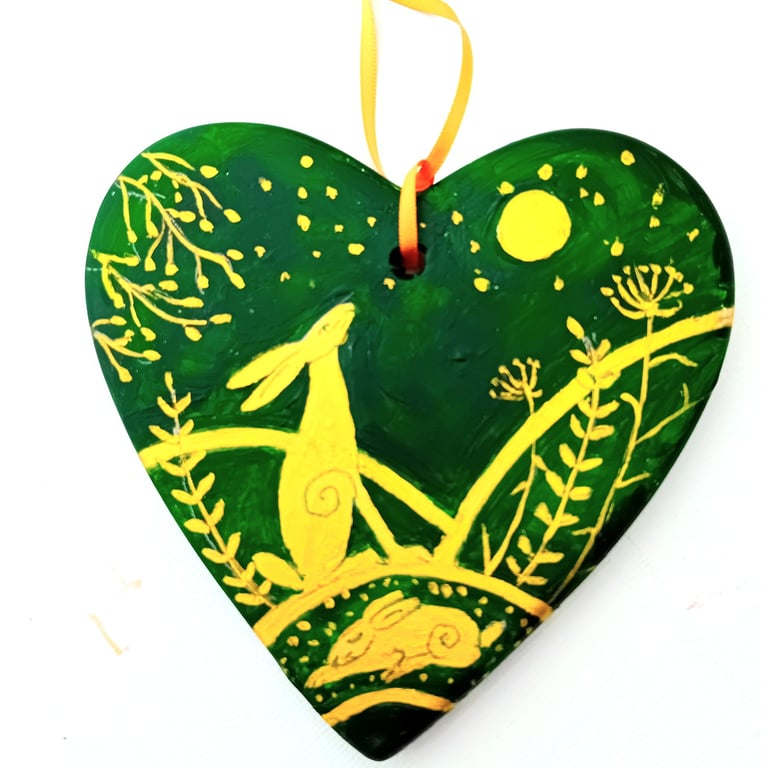 golden hare on a green ceramic heart