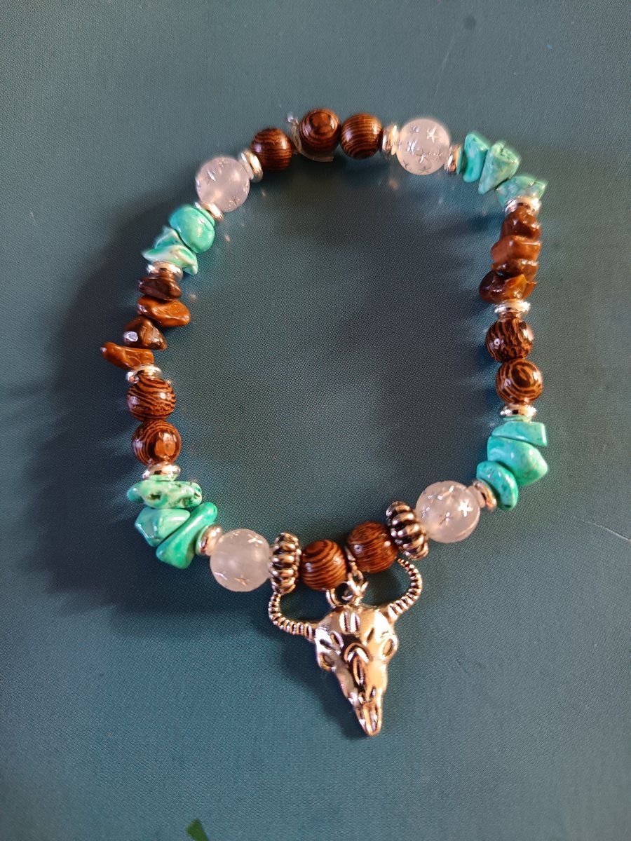 Elasticated silver goat skull charm bracelet with wooden beads and crystal chip 