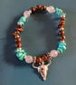 Elasticated silver goat skull charm bracelet with wooden beads and crystal chip 