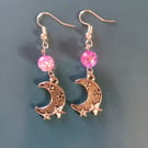 Silver cresecent moon dangle earrings with lilac bead detail