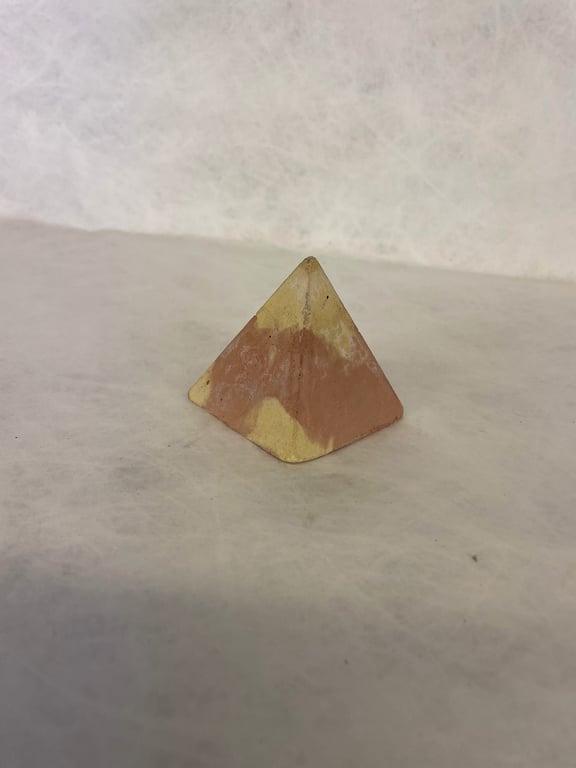 Pyramid made from traditional concrete mixtures indoor or garden ornament