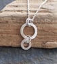 Silver Ring Necklace Pendant, Hammered Silver with Shimmer Texture - Image 1