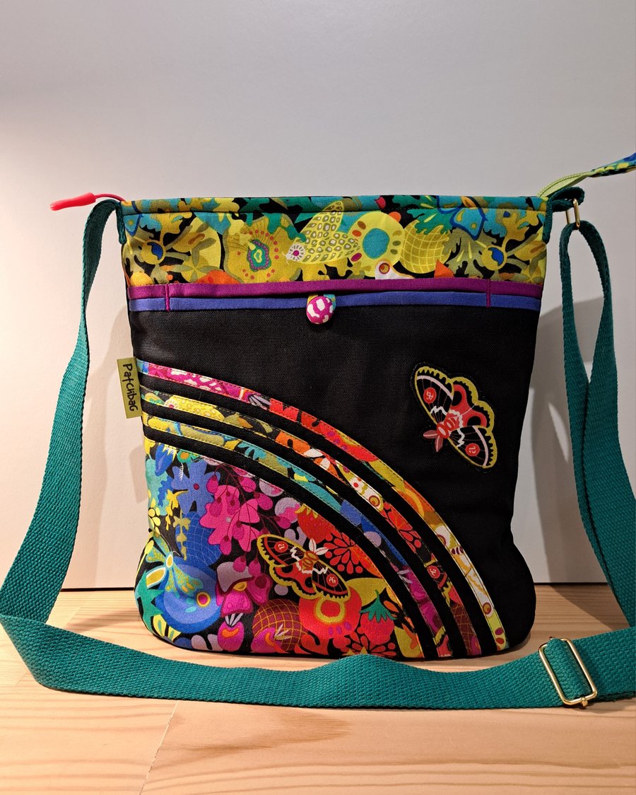 Handbag with colorful flowers and butterflies 