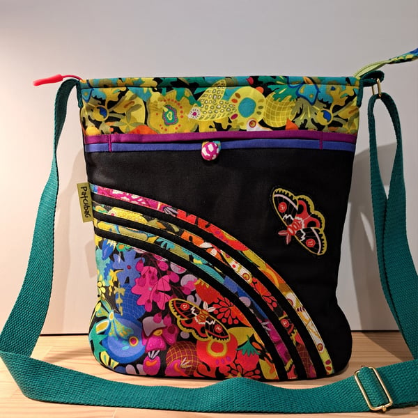 Handbag with colorful flowers and butterflies 