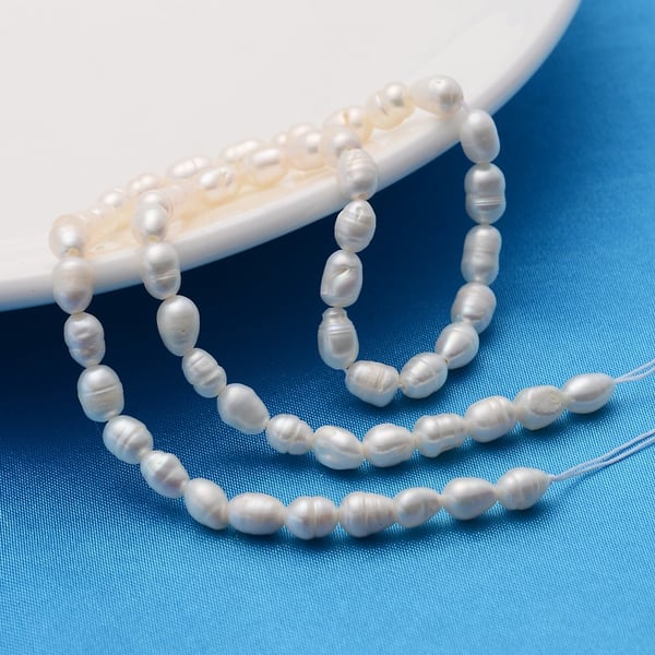 Freshwater Pearls cultured natural grade A x 2 strands rice shape 