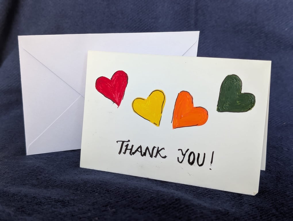Hand-painted card featuring hearts and a handwritten “Thank You” message