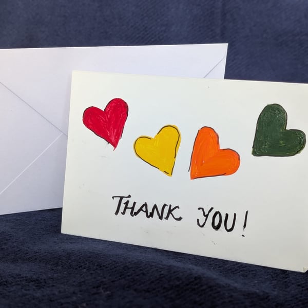 Hand-painted card featuring hearts and a handwritten “Thank You” message