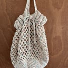 Crocheted market bag with solid base and draw string 