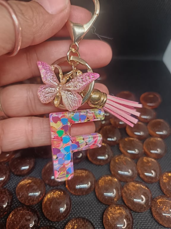 Initial keyring made from epoxy resin in the shape of the letter F
