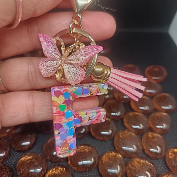 Initial keyring made from epoxy resin in the shape of the letter F