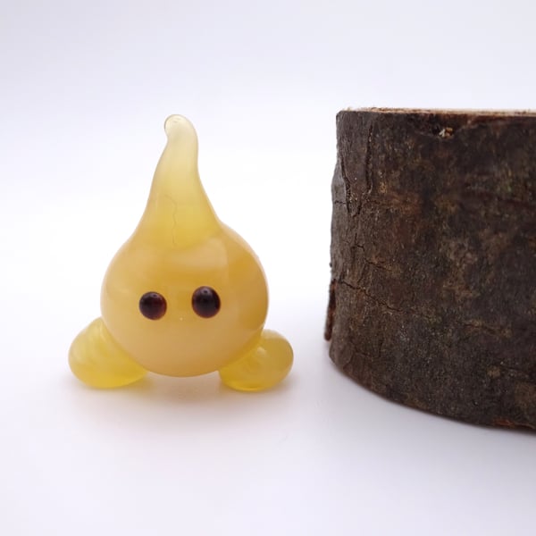 small glass wisp figure
