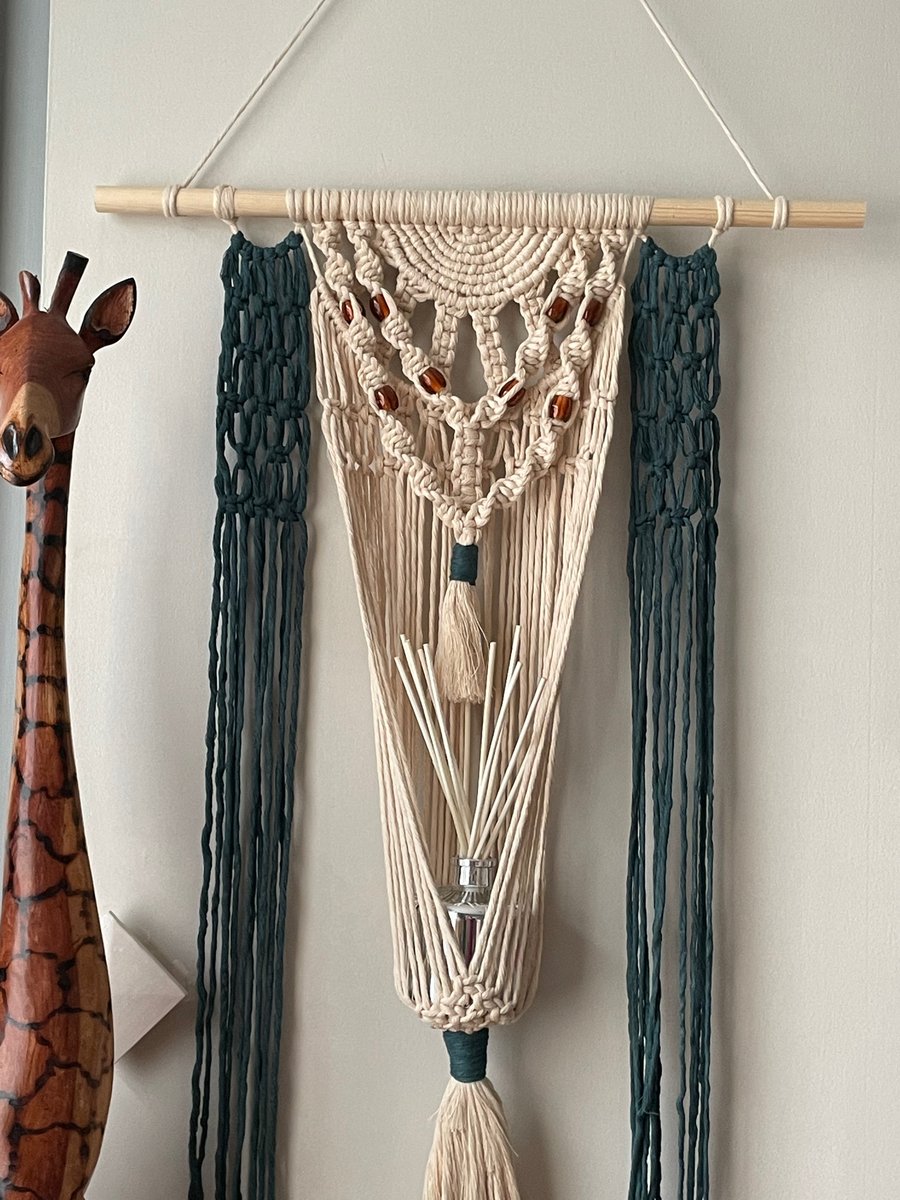 Macrame wall hanging with reed diffuser