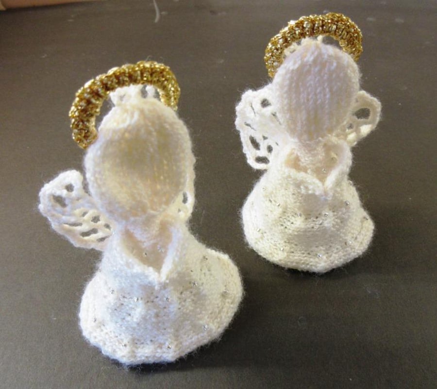 2 hand-knitted angel Christmas tree ornaments with crocheted wings and gold halo