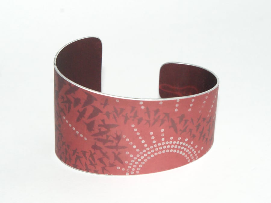 Flock of birds cuff - orangey red