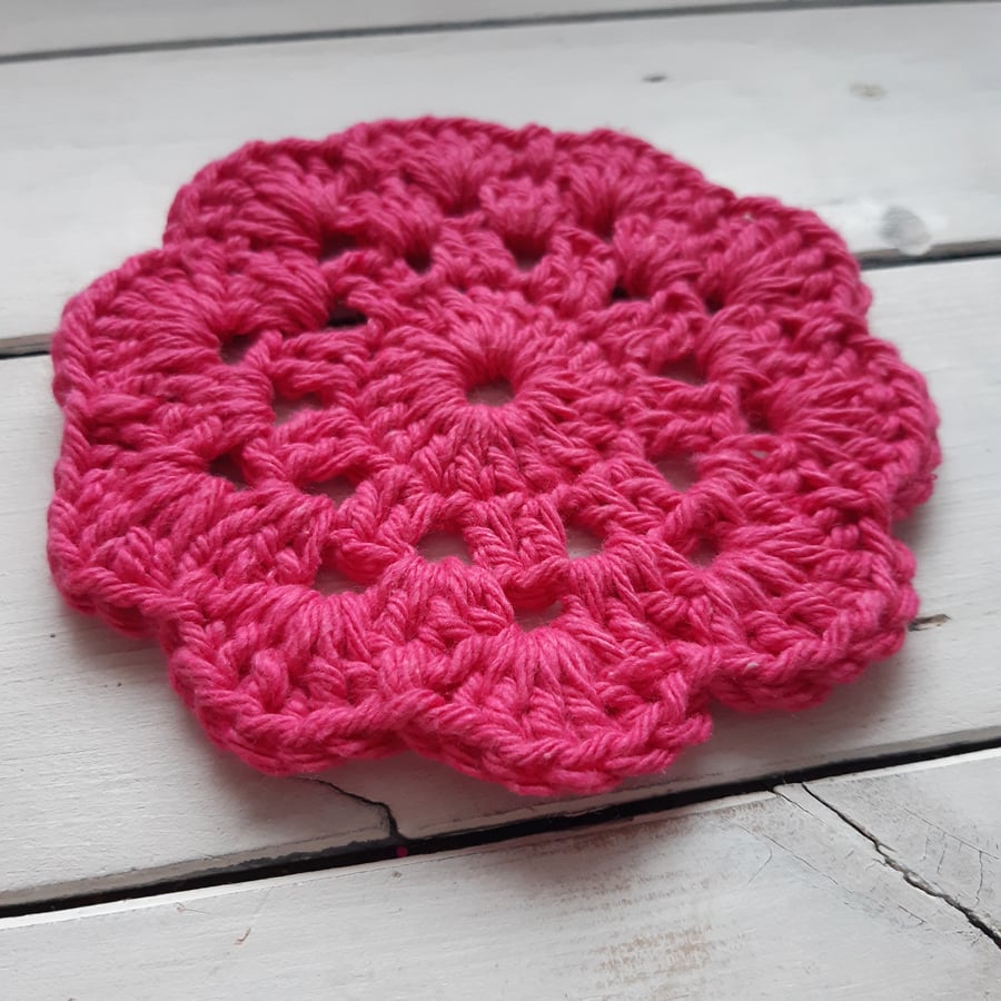 Pink crocheted tea coaster