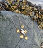Gold silver mother of pearl disc statement necklace