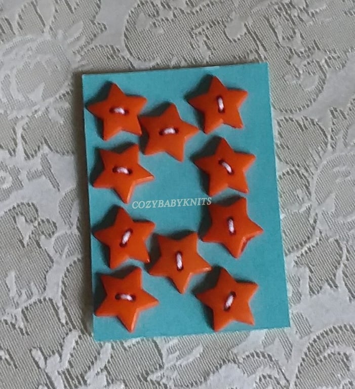 16MM ORANGE STAR PLASTIC BUTTONS WITH TWO HOLES FOR ATTACHING 