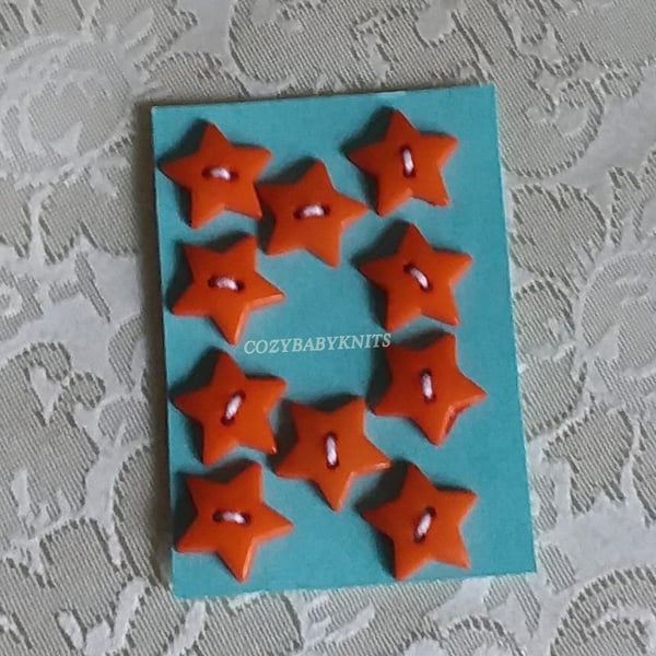 Orange star plastic buttons