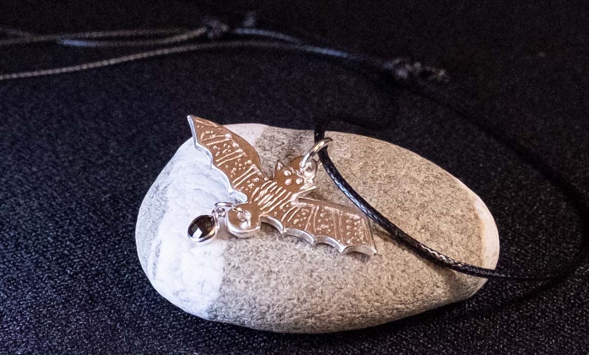 Handmade silver bat necklace with adjustable cord with black onyx gemstone