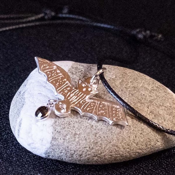 Handmade silver bat necklace with adjustable cord with black onyx gemstone
