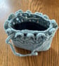 Pretty crochet handbag in pale blue recycled yarn, with a denim lining.
