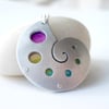 Sea shell pendant necklace with circles and rainbow colours