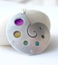Sea shell pendant necklace with circles and rainbow colours - Image 1