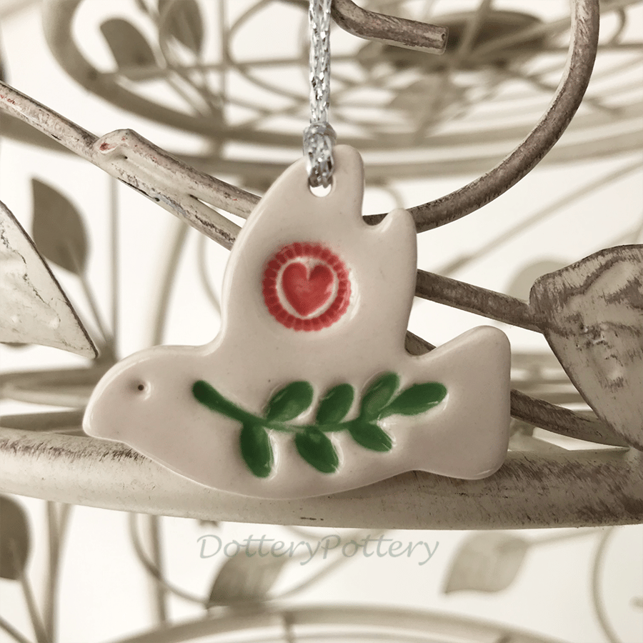 Teeny ceramic dove decoration with leaves and heart