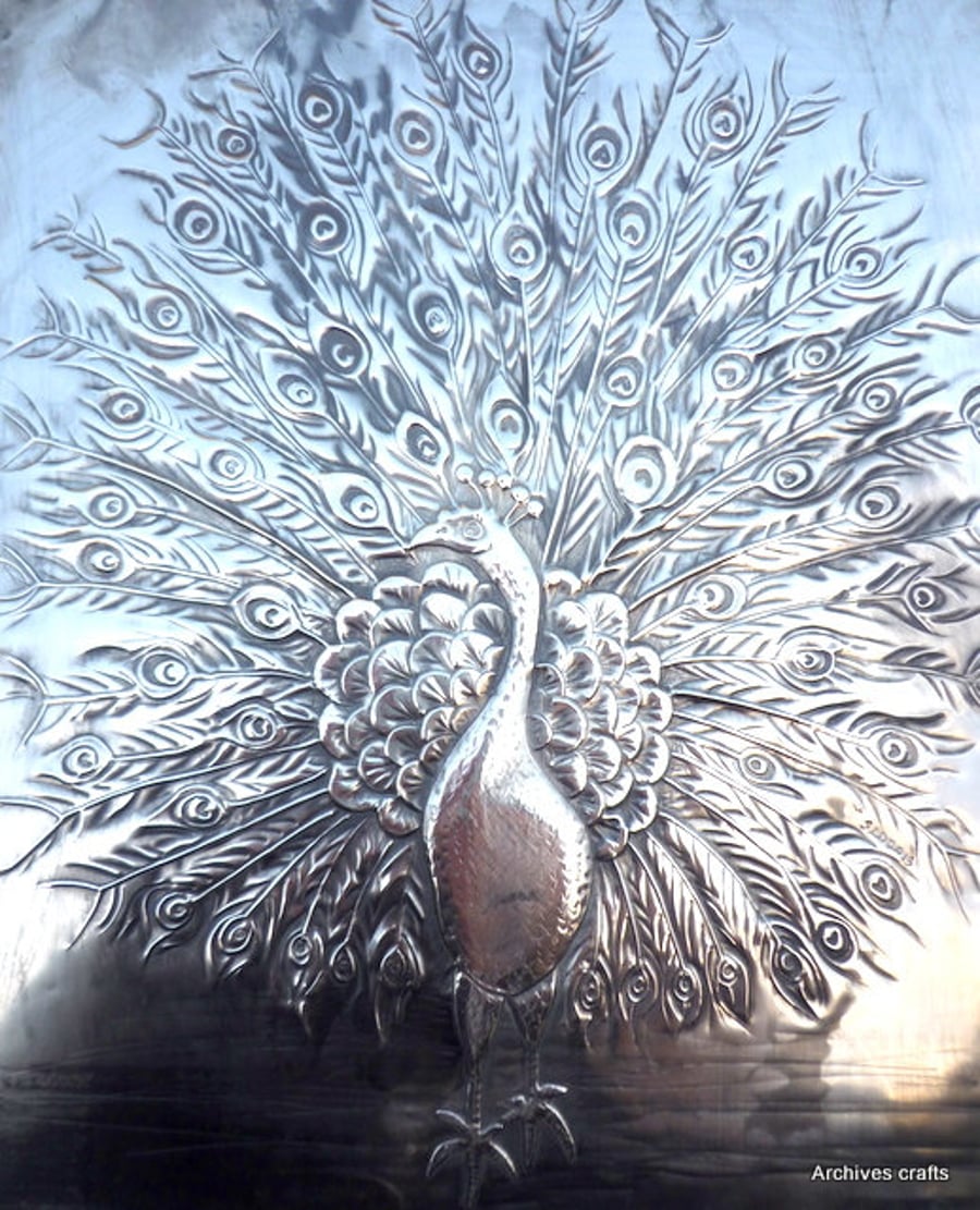 Peacock metal wall art.