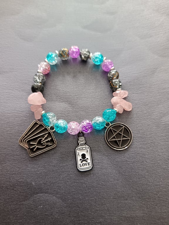 Elasticated pastel witchy potion bottle charm and bead bracelet 