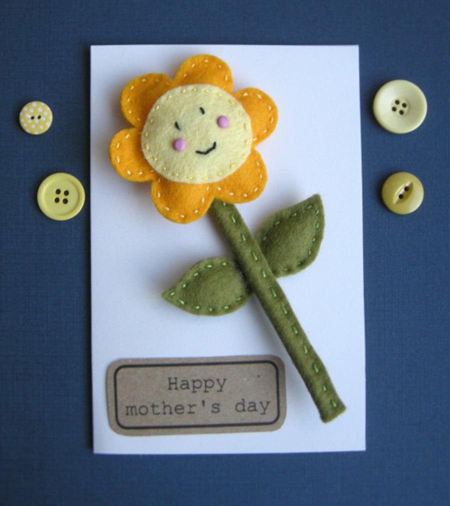 A detachable Handmade happy felt flower on a gift card can be personalised