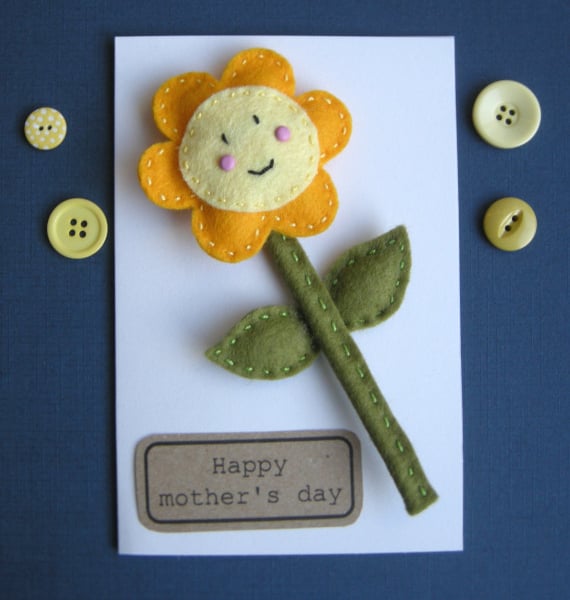 A detachable Handmade happy felt flower on a gift card can be personalised