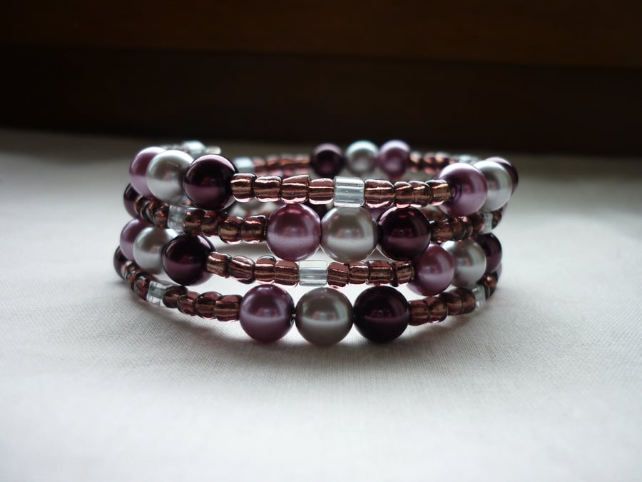 PLUM, GREY AND LILAC FROST MEMORY WIRE BRACELET.  881