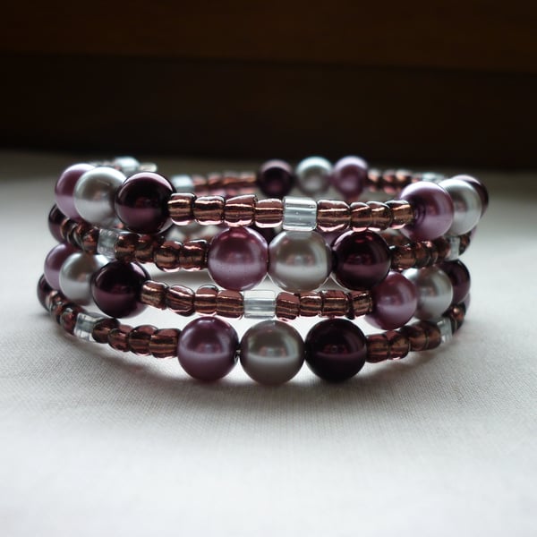 PLUM, GREY AND LILAC FROST MEMORY WIRE BRACELET.  881