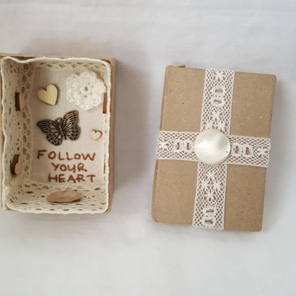 small miniature art diorama with a message to 'follow your heart'