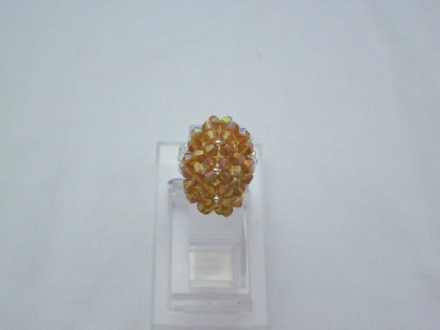 Golden yellow oval shape ring (301)