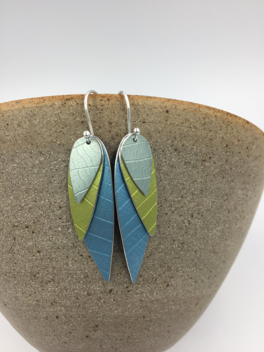 Anodised aluminium 3 layer parrot wing earrings in ice blue, green and mid blue