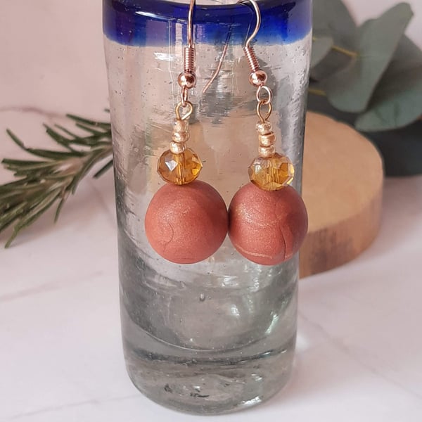 Dangly polymer clay earrings in dark salmon pink and amber