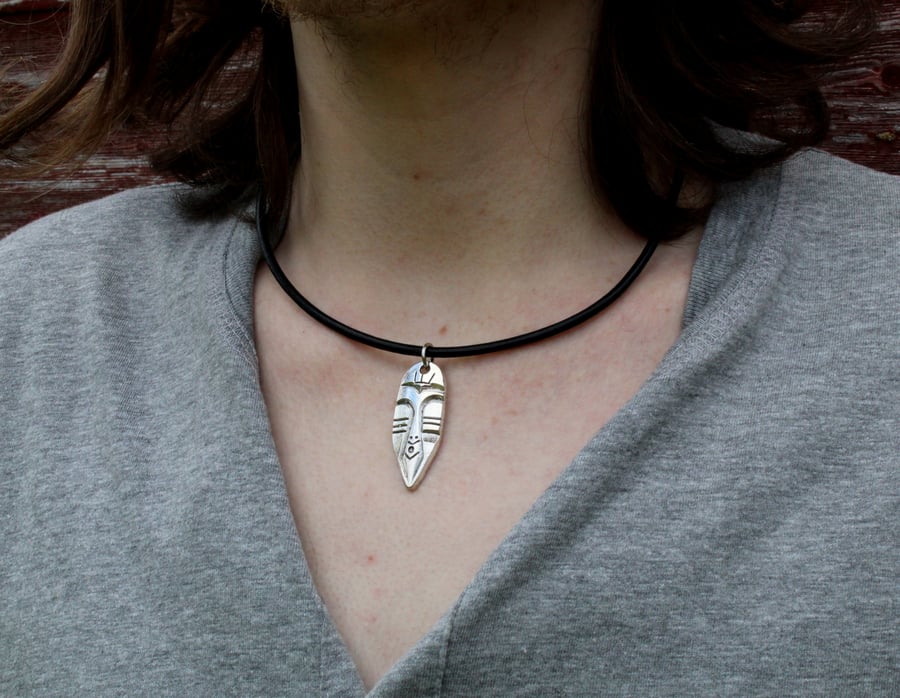 Silver African mask leather thong necklace