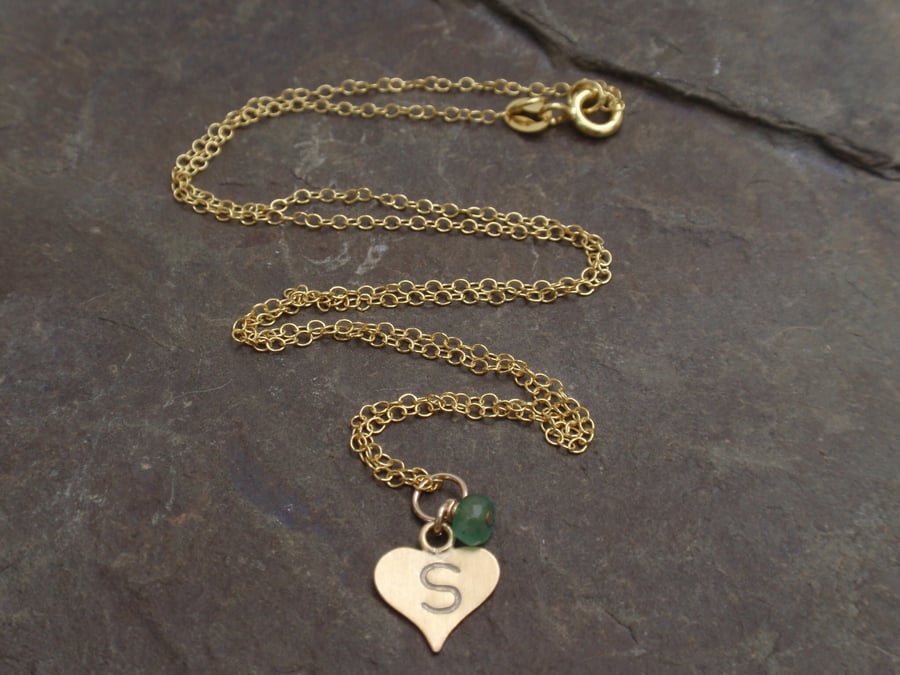 Personalised necklace with gold heart initial and a green emerald gemstone