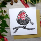 Robin Christmas card in black and red, handprinted from a linocut