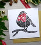Robin Christmas card in black and red, handprinted from a linocut